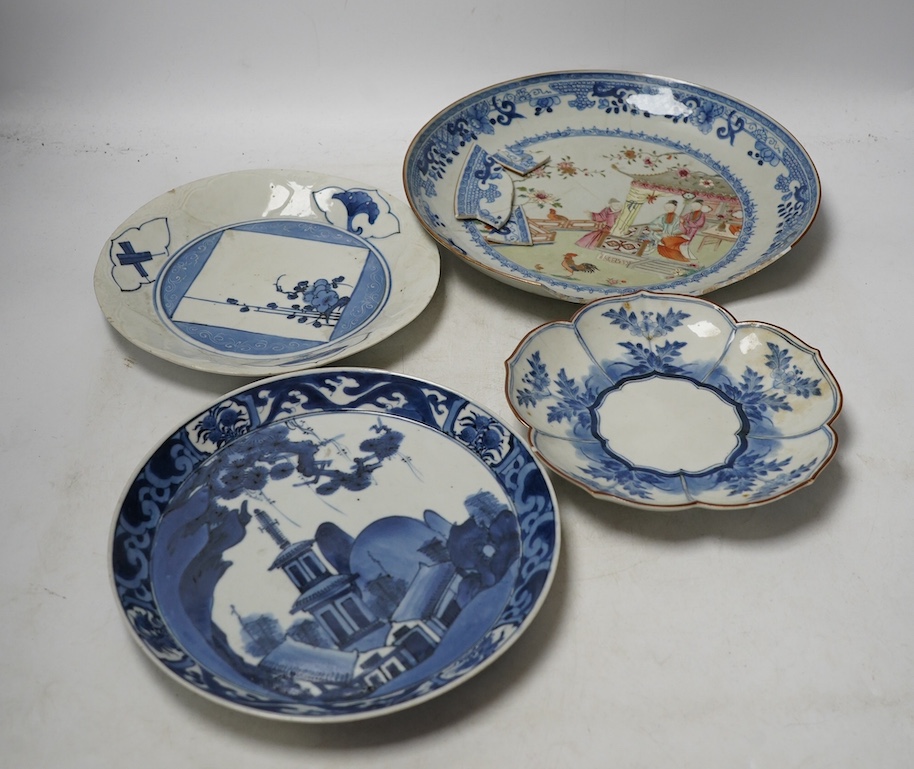 Three Japanese Kakiemon style blue and white dishes and an 18th century Chinese famille rose dish. Condition - varies